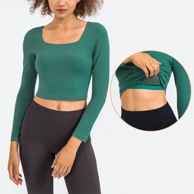 China Las señoras que la yoga remata el alto elástico envuelven de largo las camisas para mujer con el sujetador en venta