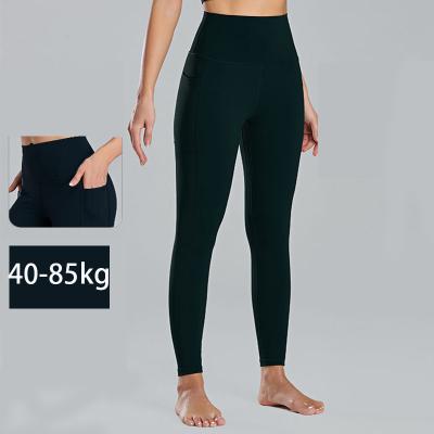 China Nude Ladies Plus Size Sports Leggings Hip Lifting Gym Leggings With Pockets for sale