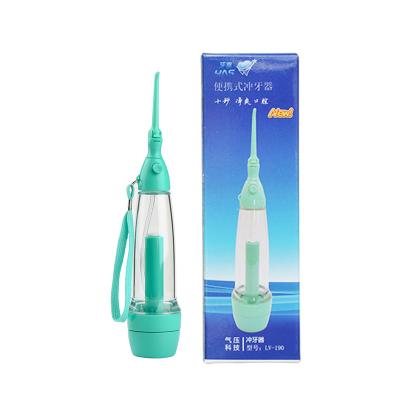 China Portable Green Water Flosser Travel Water Flosser Irrigator Cordless Non-Electric Handle Water Flosser for sale