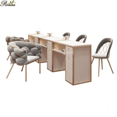 China Modern luxury design multifunctional nail art white&gold manicure table with chairs nail table with vacuum for sale