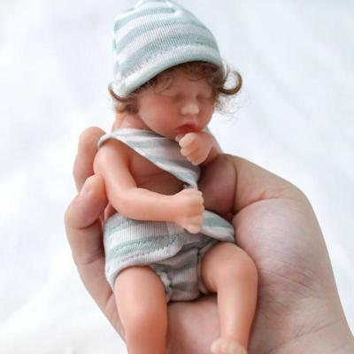 China Eco-friendly Mini Newborn Baby Bed Sleeping Toy Reborn Infant Accessories Baby Room Decoration Embryo Body White Doll for sale