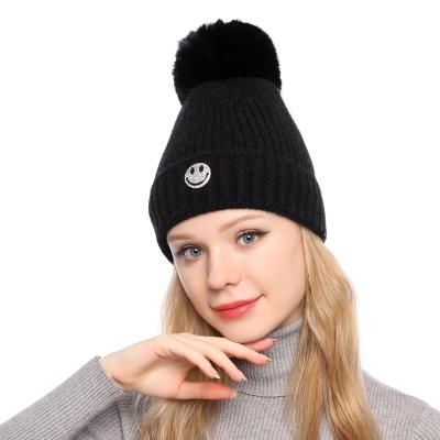 China Medium Women's Girls Winter Hat Wool Knitted Beanie With Big Pom Pom Cap Ski Snowboard Hat for sale