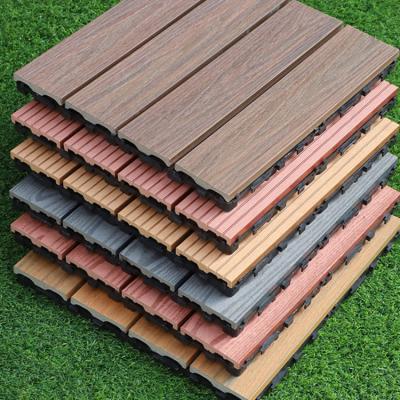 China Diy Waterproof Deck Tiles Outdoor Flooring Cheap Chocolate And Wpc Price Reddish Brown Hollow Decking 300 x 300 Wood Plastic Decking for sale