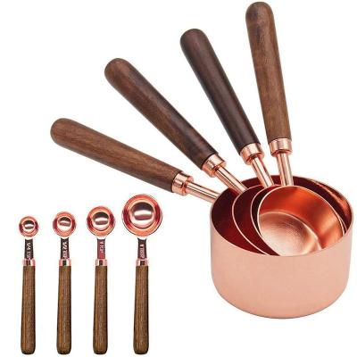 China Rose Gold Sustainable 4 Pieces Stainless Steel Kitchen Accessories Baking Tool Measuring Cups And Spoons Set With Walnut Wood Handle for sale