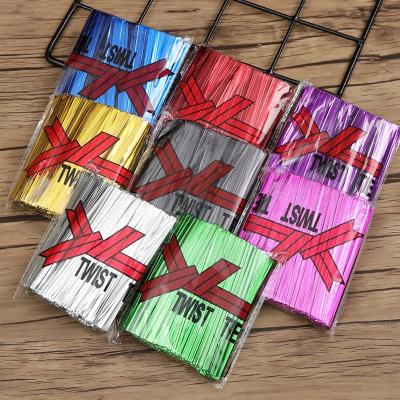 China Multicolor food wire metallic twist ties for candy bag baking packaging cello bags ligature lollipop dessert sealing twist tie for sale