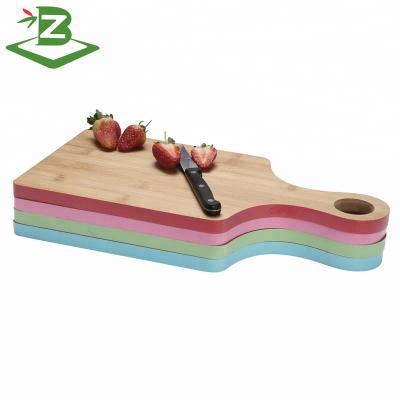 China Viable Edge Bamboo Cutting Board Hot Selling Color Chopper In Paddle Shape for sale