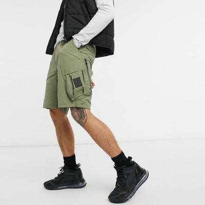 China Anti-wrinkle OEM men's gym shorts elastic waist hip hop half shorts long khaki cargo shorts for men for sale