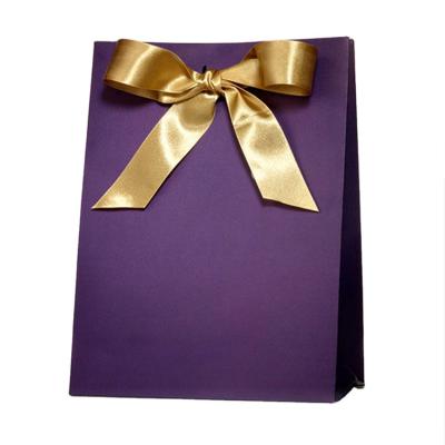 China Recyclable Promotional Blue Gift Bag Blue Jewelry Supplier Gift Bag Purple Paper Bag With Bow Tie for sale