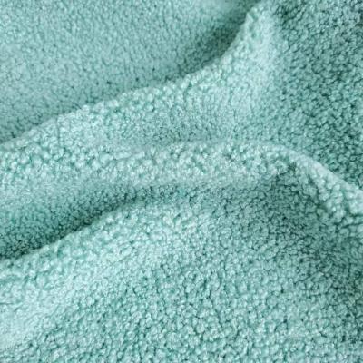 China Stretch Custom Design 100% Polyester 300gsm Brush Knit Pellet Lamb Fleece Fabric For Winter Coat Garment for sale