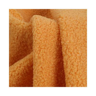 China Stretch Custom Design Popular 260gsm Plain Dyed Multi Teddy Fleece Solid Color Warm Sweater Fabric For Winter Clothes for sale