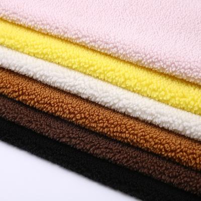 China Assured Hot Selling Quality Stretch Knitted Knot Dyed Comfortable Solid Color Soft Pellet Lamb Fleece Fabric For Clothes for sale