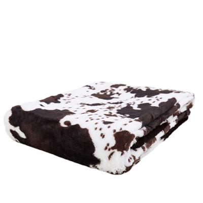 China New Design Double Layer Eco-friendly Cow Printed Faux Fur PV Plush Blanket for sale