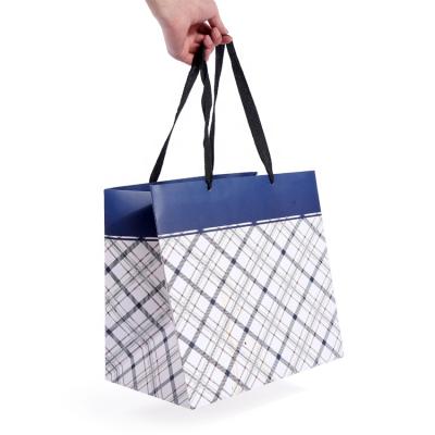 China Euro Ribbon Handle Boutique Shopping Recyclable Luxury Packaging Customized Printed Kraft Paper Gift Bags With Grid for sale