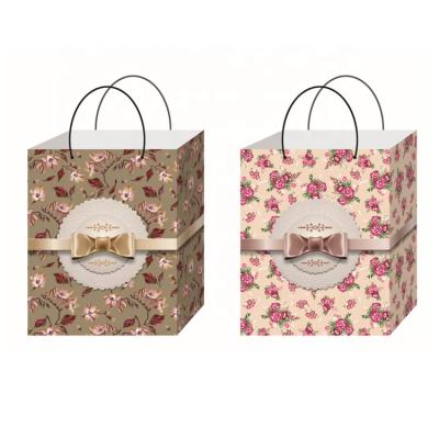 China Hot Sale Recyclable Custom Fashion Decorative Pattern Recycled Cosmetics Boutique Paper Shopping Bags Online Logo Printed for sale