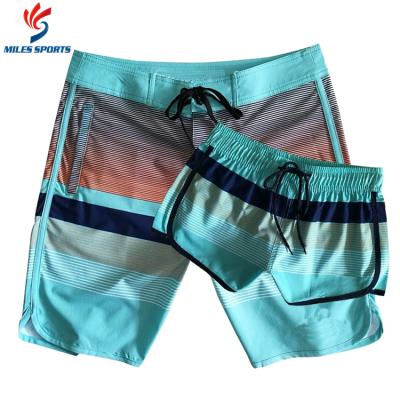 China Eco Friendly Polyester Sublimation OEM Waist Panel Long Stripes 4way Stretch Custom Orange Black White Couples Plus Swim Shorts for sale