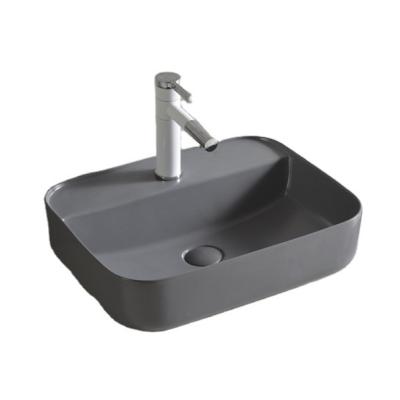 China Modern Simple Matte Color Small Size With Faucet Hole Household Hotel Office Wash Basin Ceramic Sink Wash Basin for sale