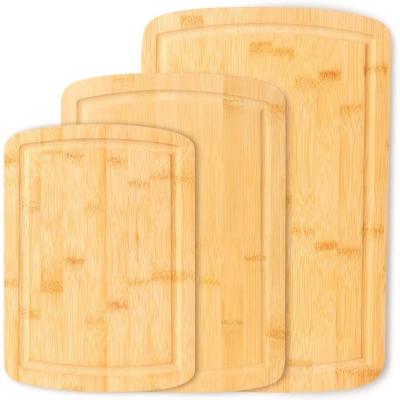 China Viable natural bamboo chopping natural bamboo chopper des tablas De madera set bamboo tagliere set with juice for sale