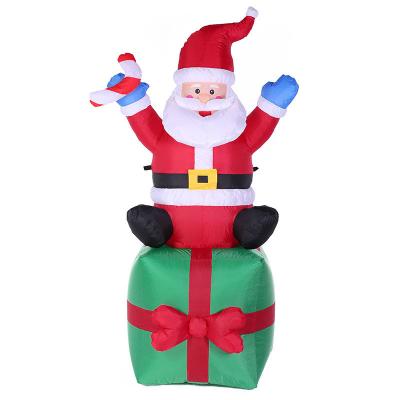 China 6 Feet 190T Polyester Blow Christmas Decorations Indoor&Outdoor LED Lights Santa On Gift Box For Garden Hotel Inflatable House for sale