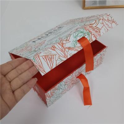 China Handmade Custom Luxury Apparel Packaging Folding Magnetic Gift Box With Ribbon Closure for sale