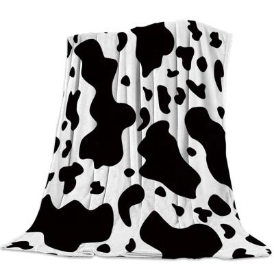 China Anti-Pilling Cute Style Pet Cow Printing Folded Fleece Blanket For Kids for sale