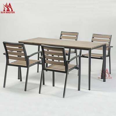 China Modern Outdoor Garden Furniture Waterproof Patio Leisure 4 Pieces Plastic Wood Slats Dining Chiar And Coffee Table Set Modern Hot Sale for sale