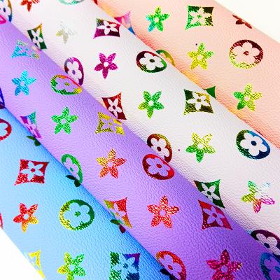 China 2020 New Abrasion-Resistant Flowers Embossed Pattern Printed On Lychee Vinyl Synthetic Leather Sheets For Hair Bows Earrings Crafts for sale