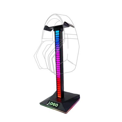 China Pickup Rhythm / Logo Luminous / Multifunctional USB Port Customize RGB Logo Headset Stand Hanger Earphone Bracket Holders With Mobile Phone Stand Earphone Display Stand for sale