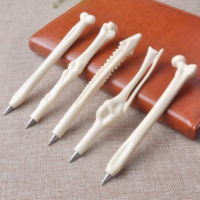 China Top creative diamond bone ball pen ballpoint pen promotional pen in bones shape pen for sale