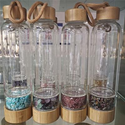 China Factory Logo Bamboo Lid Crystals Viable Custom Healing Glass Stones Crystal Drinking Water Bottle for sale