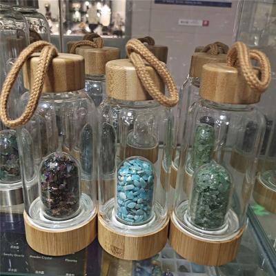 China Europe cheap price healing different material crystal gravel tumbles stone water bottle with bamboo lid for sale