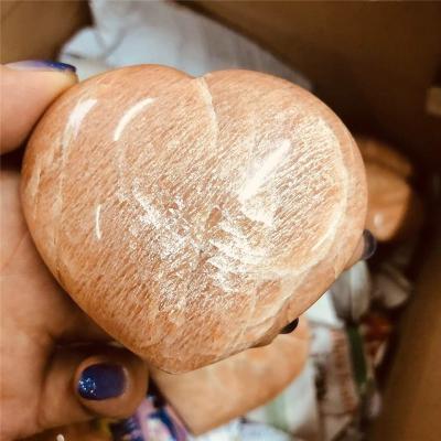 China Natural quartz crystal orange crystal heart moonstone Europe peach moonstone stone for decoration for sale