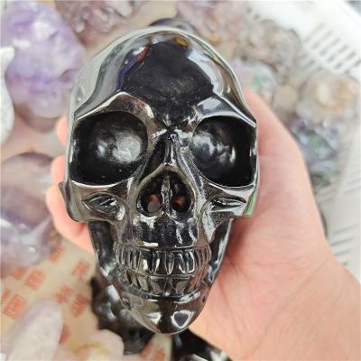 China Wholesale Europe Hand Carved Nature Black Tourmaline Quartz Crystal Skulls for sale