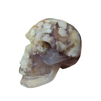 China Europe crystal skulls folk crafts wholesale flower agate carved skulls for fengshui healing for sale