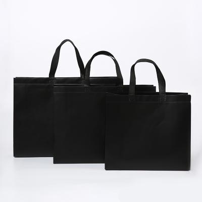 China Custom top quality promotion price laminated luxury handled non-woven black tote shopping bag with printed logo à venda