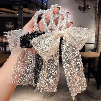 China Comfortable Soft Women Girls Lace Up Bow Knot Ribbon Elastic Stats Headwear Pearls Hair Ties Hair Ropes Band for sale