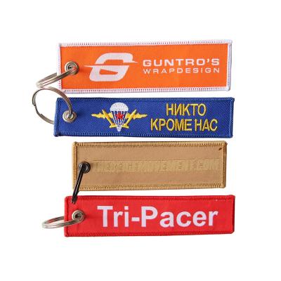 China Classic High Quality Embroidered Fabric Custom Key Flag / Keytag / Keyring Key Chain for sale