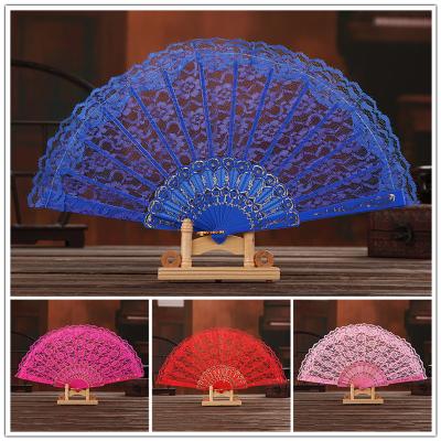 China 2022 China Solid Color Cavity Lace Flower Fan Hand Held Folding Fans Decorative Festival Gift Crafts Art for sale