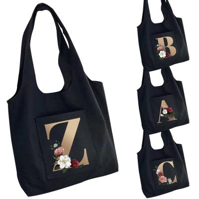 China Fashion Women Bag Canvas Bag Large Capacity Travel Tote Bag Printing 26 Letters Flower Hot Gold One-shoulder Portable Shopping Bag for sale