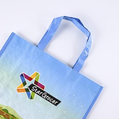 China Custom Sizes Eco - Friendly Recycle Glossy Laminated PP Woven Polypropylene Bag Packaging Handled for sale