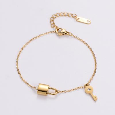 China TRENDY Tarnish Free Jewelry 18k Gold Plated Stainless Steel Lucky Key Lock Bracelet for sale