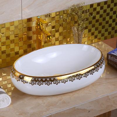 China Eco-friendly Gold Plated Ceramic Oval Sink Toilet Room Luxury Gold Plated Home Hotel for sale