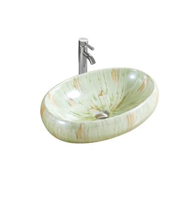 China Fashion Eco-friendly Italian Style Bathroom Marble Sink Light Green Printing Ceramic Oval Wash Basin for sale