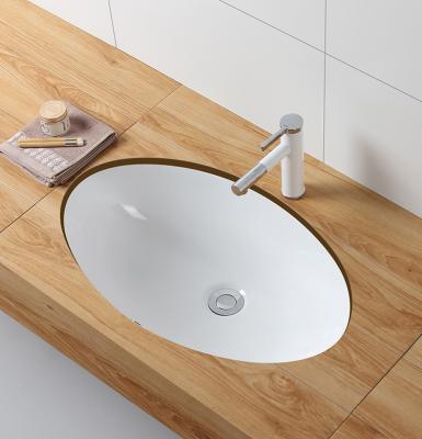 China Eco-Friendly Bathroom Under Counter Large Capacity Oval Ceramic Deep Wash Basin Sinks Modern Desgin for sale