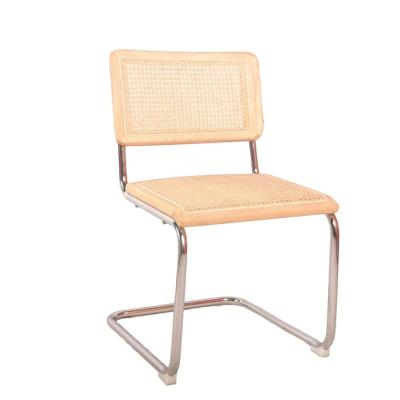 China Adjustable (height) High Quality Nordic Cane back Rattan Metal frame Beech wood chair Cantilever Cafe for restaurant dinning room Armless chair for sale