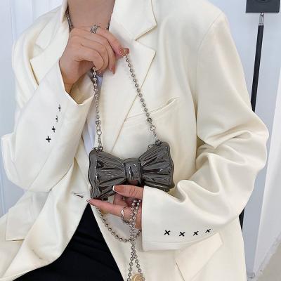 China 2022 Spring Portable Luxury Vintage Metal Ladies Hand Shoulder Sling Bags Bowknot Women's Mini Crossbody Bags for sale