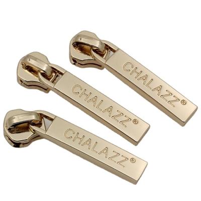 China Durable Custom Metal Zipper Ends Zipper Sliders Key Puller With Letter Logo For Clothing And Bags for sale