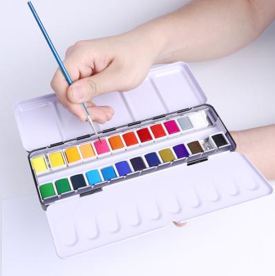 China Easily Mix 2021 New Watercolor Paint Set 24 Vivid Colors in Pocket Box with Metal Ring and Watercolor Brush for sale