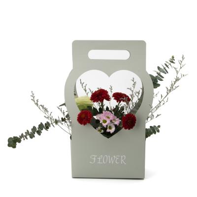 China Recyclable Cardboard 750g Romantic Wedding Florist Flower Basket Big Size Paper Flower Bags With Love Handle for sale