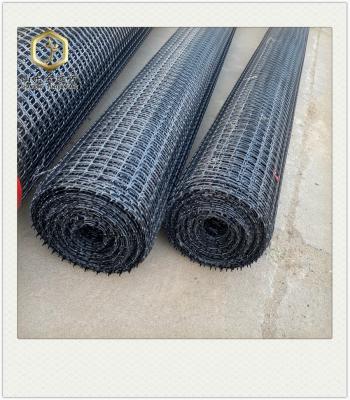 China Modern Asphalt-coated geogrid 30KN is used to reinforce roads for sale