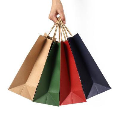 China High Quality Eco-Friendly Handmade Colorful Red Twisted Brown Blue Green Kraft Paper Handle Shopping Carrier Bag With Logo Printed for sale